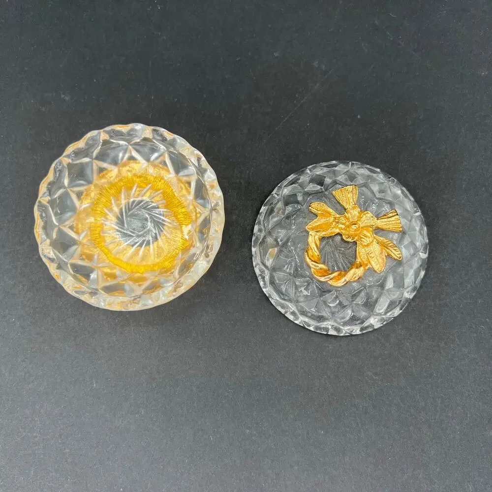 Stylebuilt trinket box, 24K gold plated and a crystal or glass top.